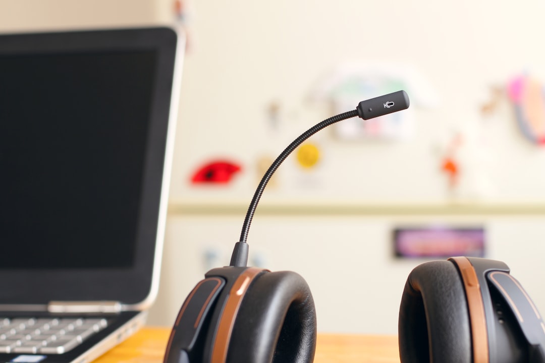 Headset beside a laptop representing customer response and AI receptionist systems