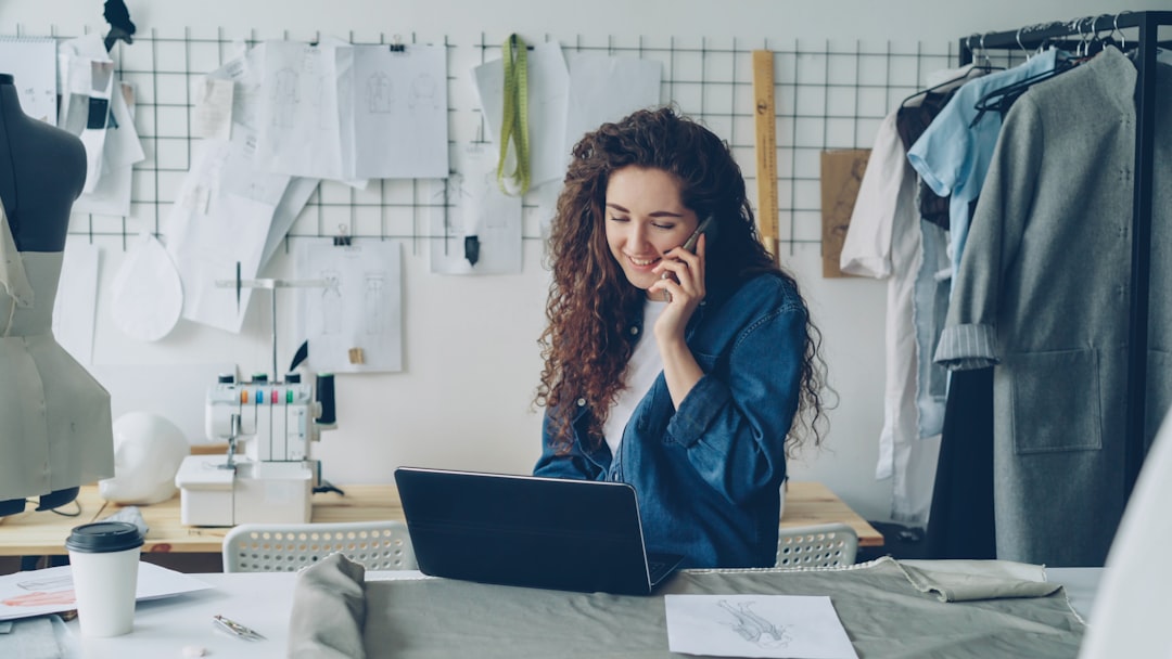 Small business owner working with a laptop in a design studio