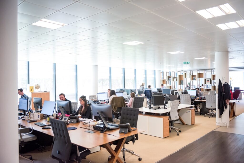 Customer support office representing AI receptionist versus human answering service