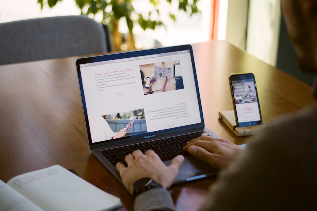 Professional working on a laptop representing signs a business website needs a redesign