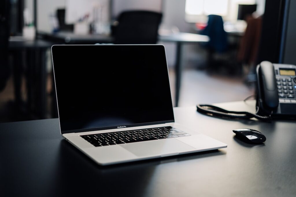 Laptop on a desk representing essential small business website pages
