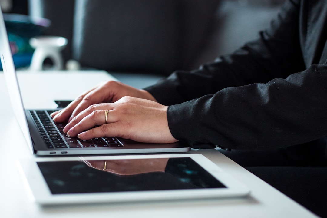 Business professional using a laptop representing a professional trustworthy website