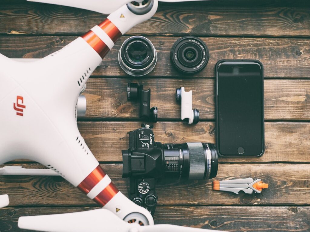 Professional camera and drone gear representing business photography and video production services
