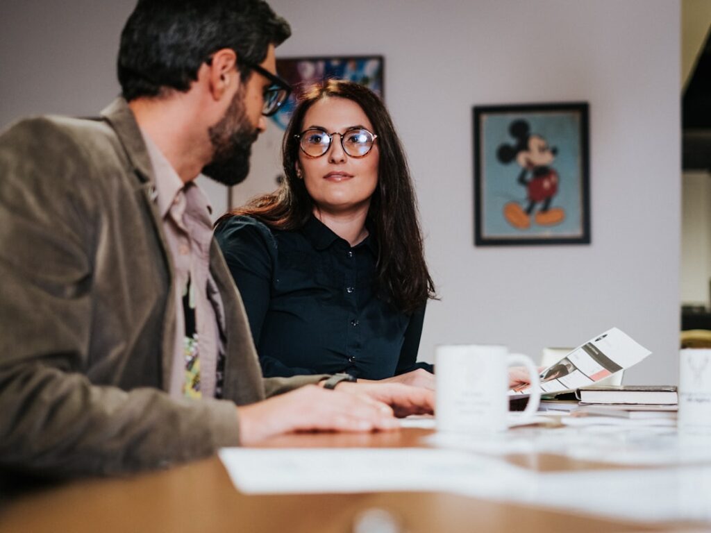 Small business owners meeting at a table representing digital marketing budget planning