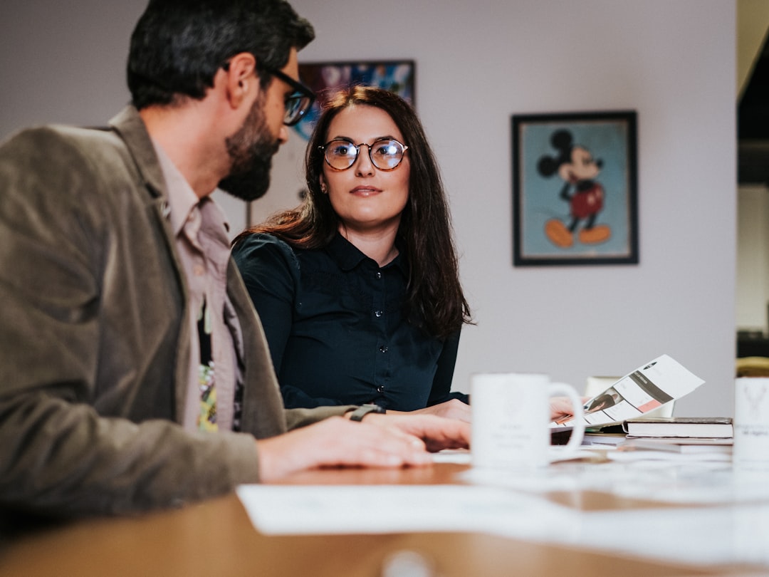 Small business owners meeting at a table representing digital marketing budget planning
