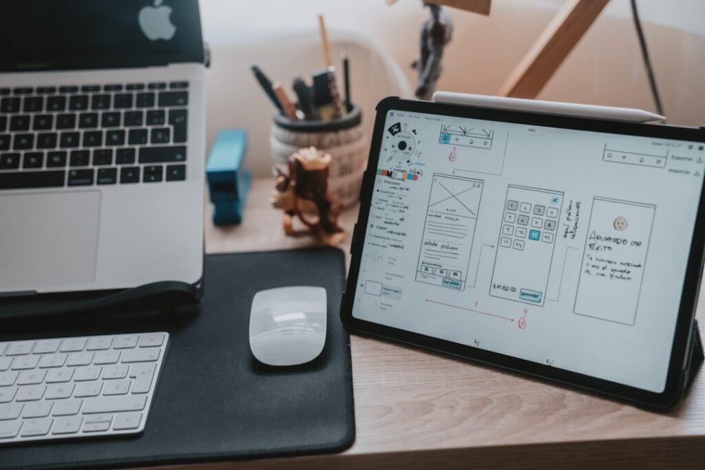 Laptop workspace representing mobile-first website design and lead conversion for small businesses