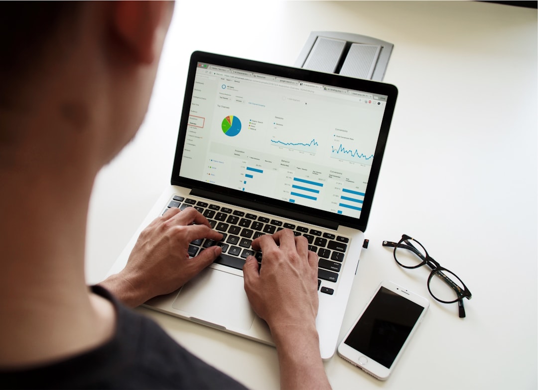Business team using a laptop representing schema markup and structured data implementation