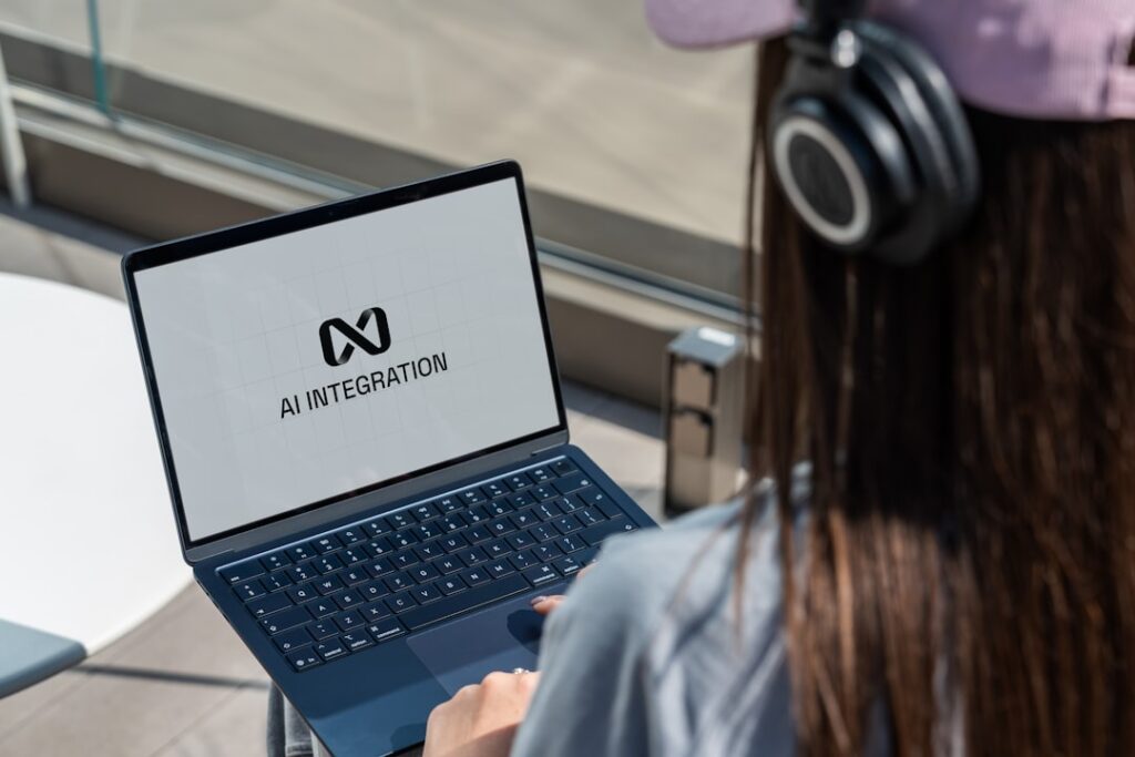 Computer user working with AI technology representing human-in-the-loop automation oversight