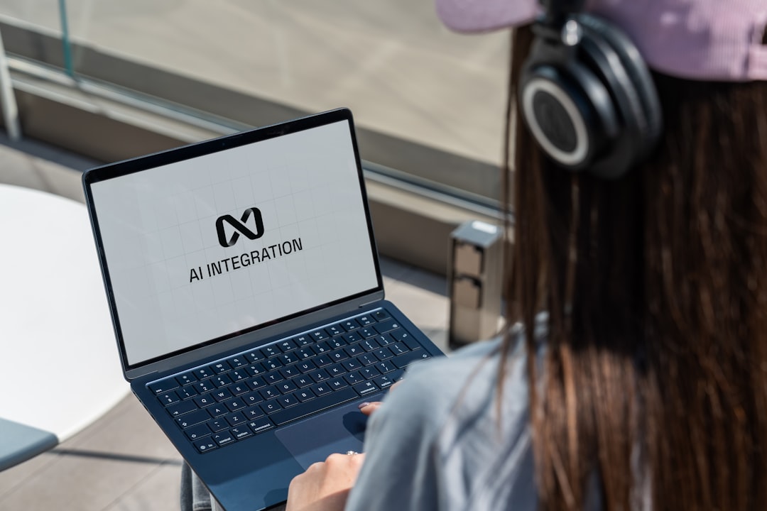 Computer user working with AI technology representing human-in-the-loop automation oversight