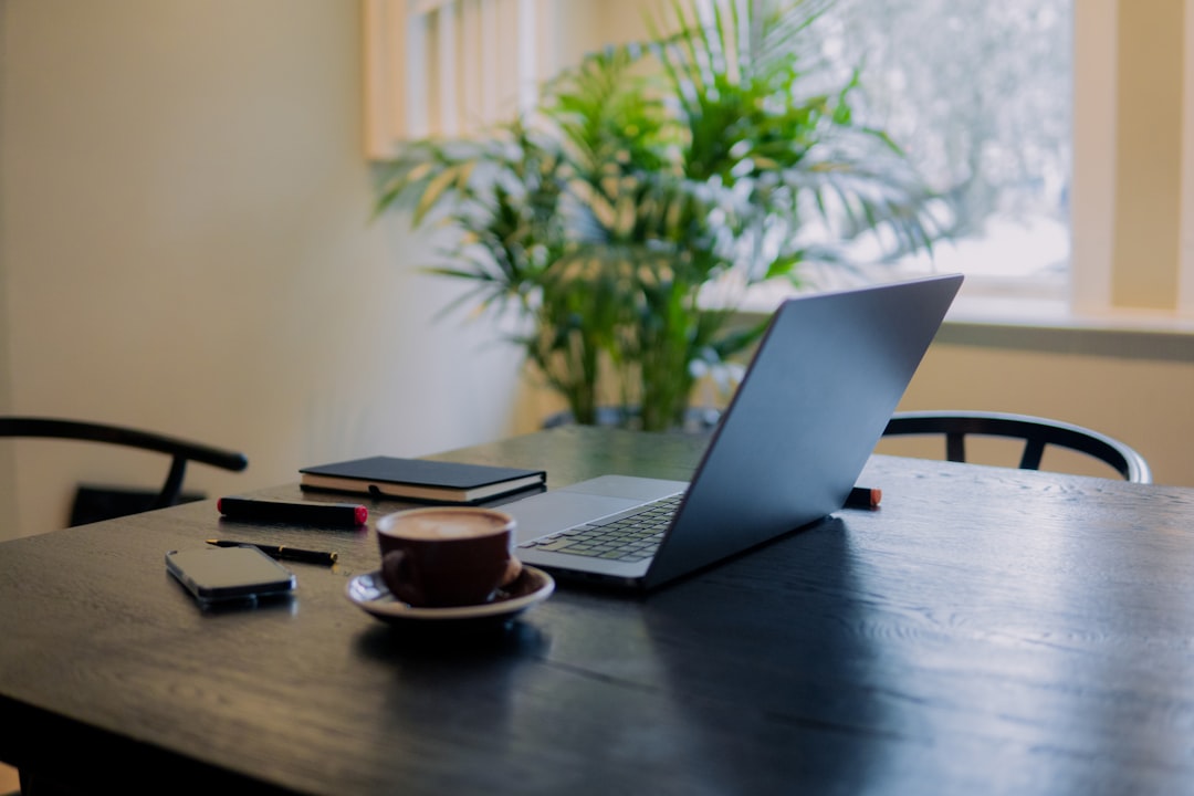 Laptop and notebook in a workspace representing a small business website launch checklist